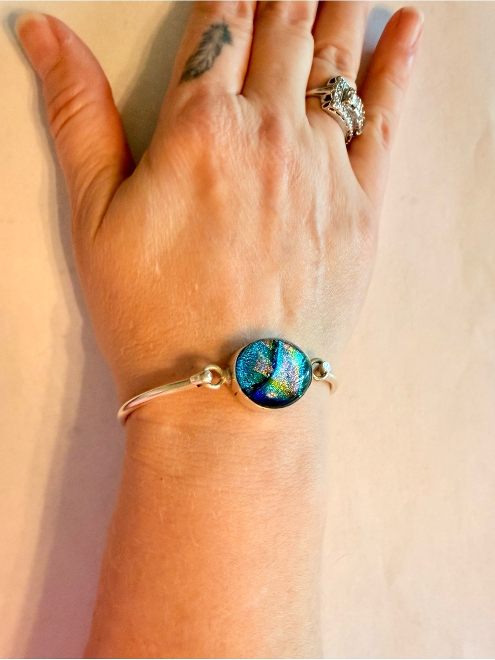 Silver Bangle Bracelet with Iridescent Blue-Green Dichroic Glass Center